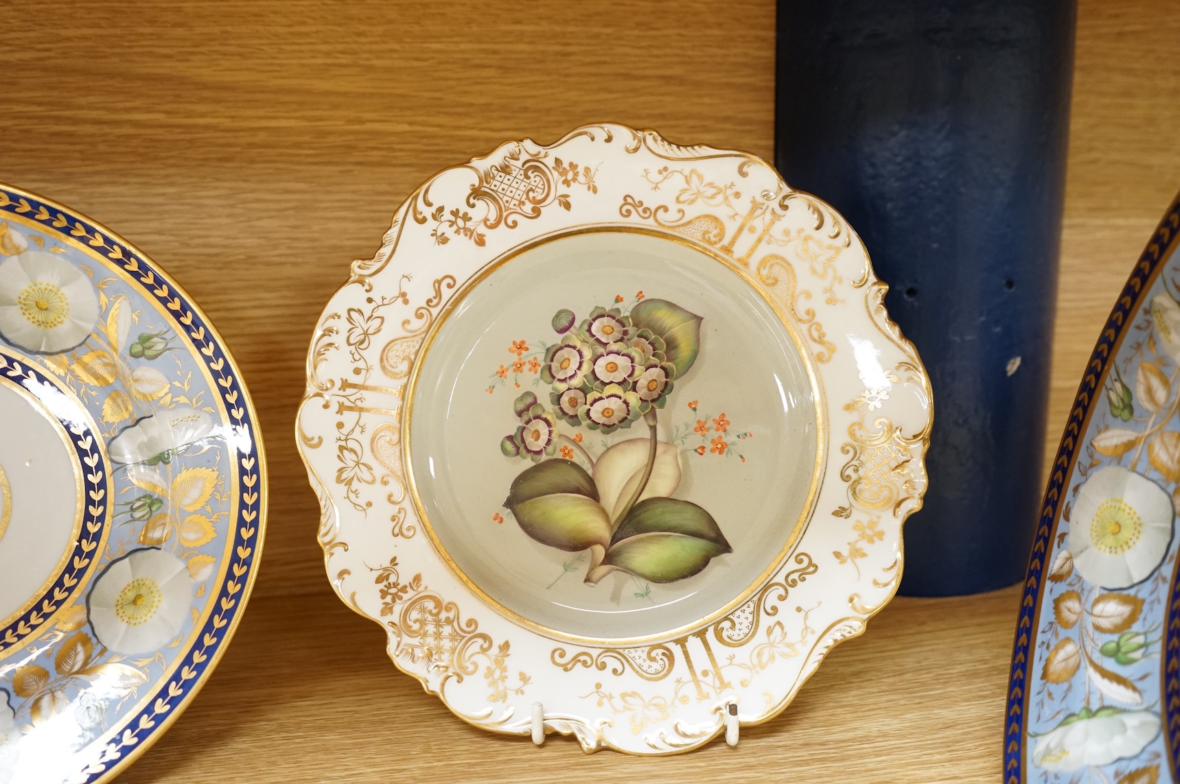 Two pairs of early 19th century porcelain botanical dishes, largest 22cm in diameter
